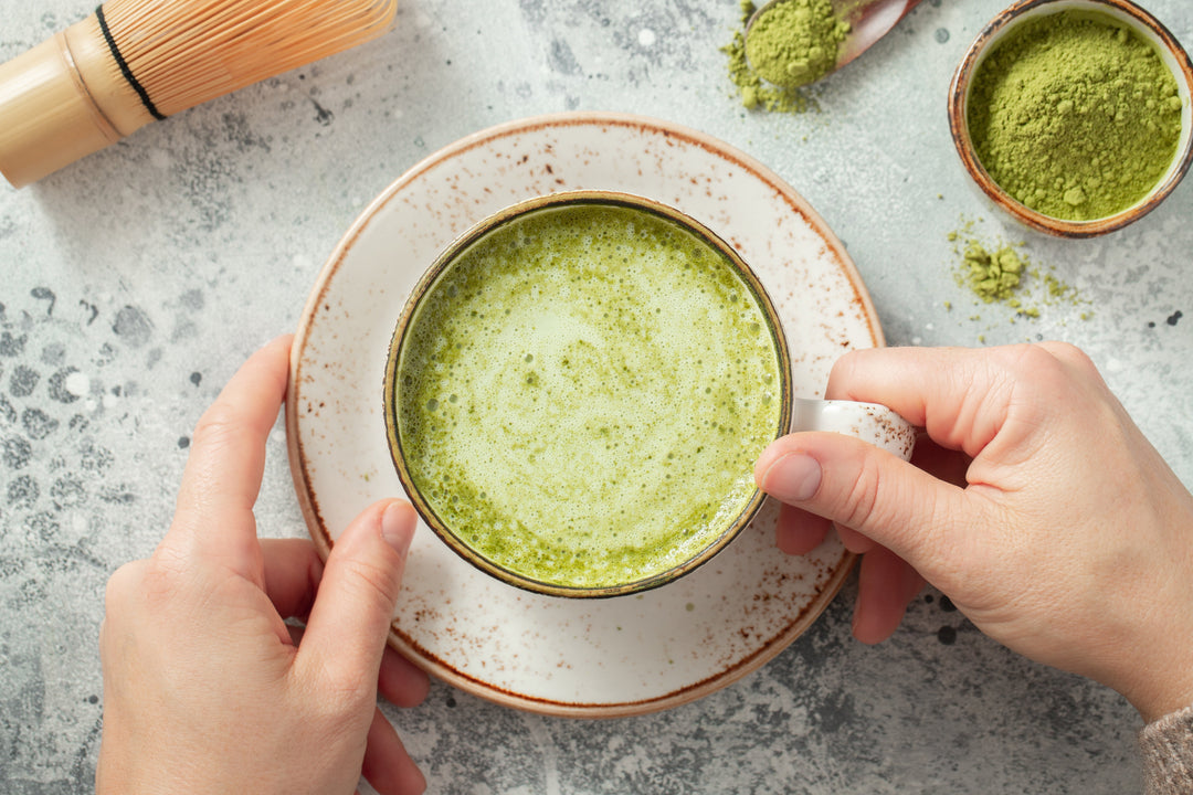 Creamy matcha latte in ceramic mug