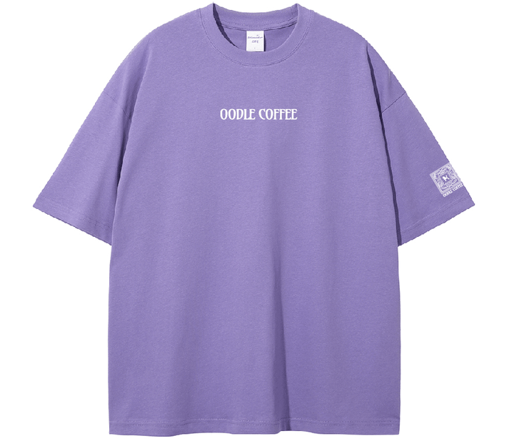 Purple t-shirt with 'Oodie Coffee' text on a white background